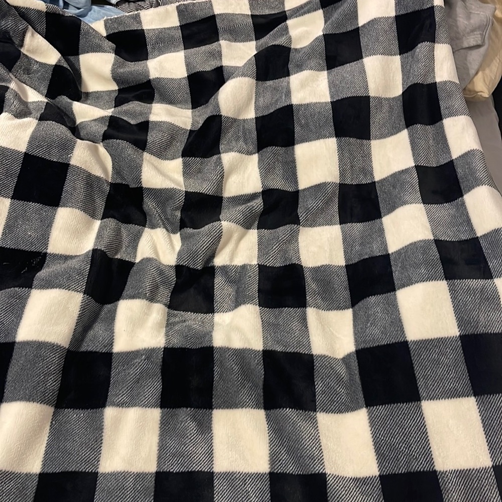 Soft plaid blanket, keeps you really warm.